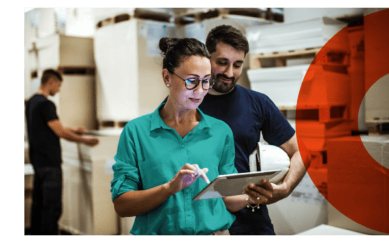 Warehouse workers reviewing orders—representing Chamber duty-free and tax-free business benefits.