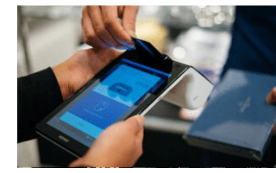 Tap payment on touchscreen terminal—highlighting secure, cost-saving payment processing solutions available to Chamber members