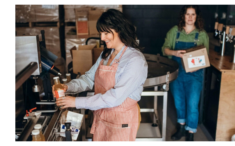 Hands typing on a laptop with floating icons for email, likes, and engagement—representing email marketing and digital outreach tools available to Chamber members